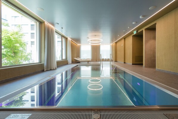 Indoor pool, open 7:00 AM to 10:00 PM, pool loungers