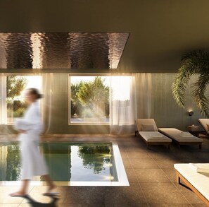 Indoor pool, open 6:00 AM to 10:00 PM, pool loungers