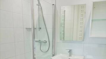 Shower, hair dryer, towels, soap