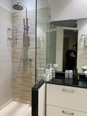 Shower, hair dryer, towels, soap