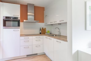 Dishwasher, coffee/tea maker, toaster, dining tables