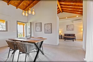 Deluxe Double Room | Living area | 40-inch Smart TV with cable channels, Netflix, streaming services - Comissa Luxury Suites (Corfu)