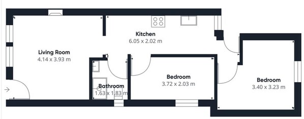 Un plano de planta que muestra una sala de estar, cocina, dos dormitorios y un baño.