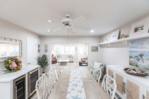 A spacious kitchen with a central island, white cabinetry, and a ceiling fan. - Villa 20 - Premium Plus (Siesta Key)