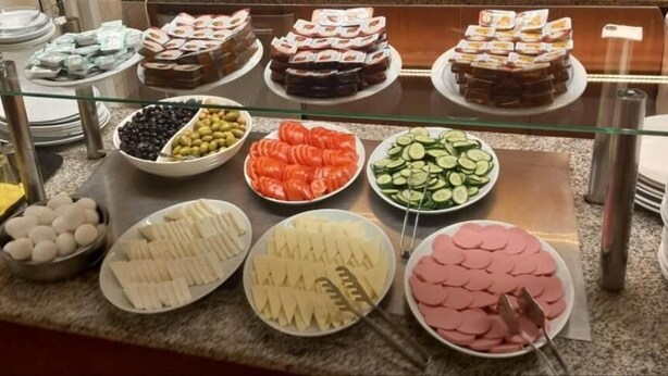 A buffet with various food items including fruits, cheeses, and meats. - Hotel Nayla (Istanbul)