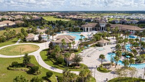 A resort with a central pool, multiple lounge areas, and a well-maintained landscape. - Amazing Resort Private Pool Chg102 (Davenport)