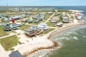 A coastal residential area with houses, a beach, and a pier. - Cyan Sea - Beautiful Sunrises & Sandy Seas, Relax! (Freeport)