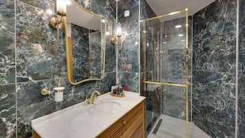 Deluxe Room | Bathroom | Hair dryer, slippers, towels, soap