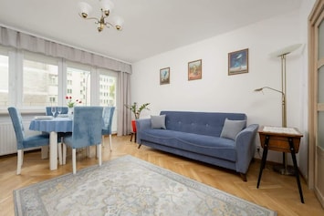 Cozy living room with a comfortable sofa and elegant decor.