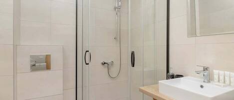 Shower, hair dryer, towels, shampoo