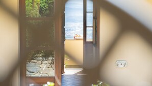 A hallway with a view of a balcony and a stone wall. - Country House in Touscany ID 4161 (Buti)