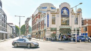A street view with a building featuring a large sign reading "MICHELIN". - The Elden - No.17 (London)