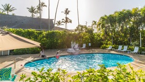 A swimming pool with lounge chairs and palm trees in the background. - Plantation Hale Suites F7, Ground Floor, AC, Walk to Beach (Kapaa)
