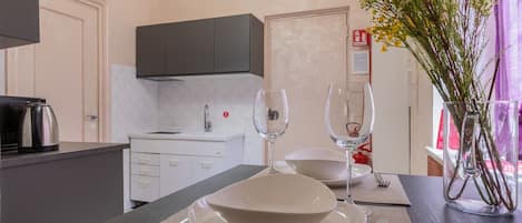 Fridge, microwave, electric kettle, cookware/dishes/utensils