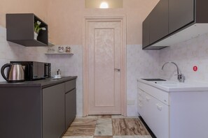 Fridge, microwave, electric kettle, cookware/dishes/utensils