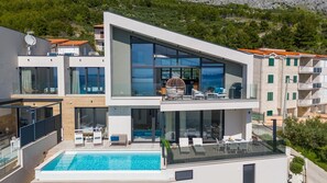 Enjoy a rooftop pool with panoramic views and a spacious balcony with seating.