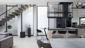 A modern interior with a staircase, dining area, and kitchen. - New Villa 55-Vrsi heated pool jacuzzi sauna bbq sea view (Vrsi)