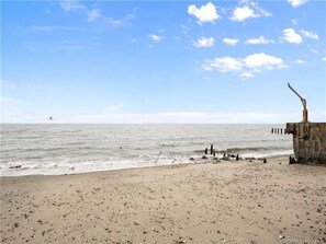 On the beach, sun loungers, beach towels