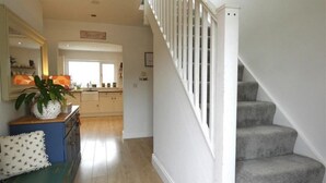 A staircase with a white railing leading to a landing. - Beautiful 4-bed House With Countryside Views (Haverfordwest)