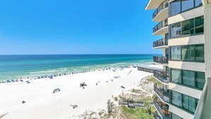 A beachfront hotel with a poolside area, a beach, and ocean views. - Sunbird 906w (Panama City Beach)