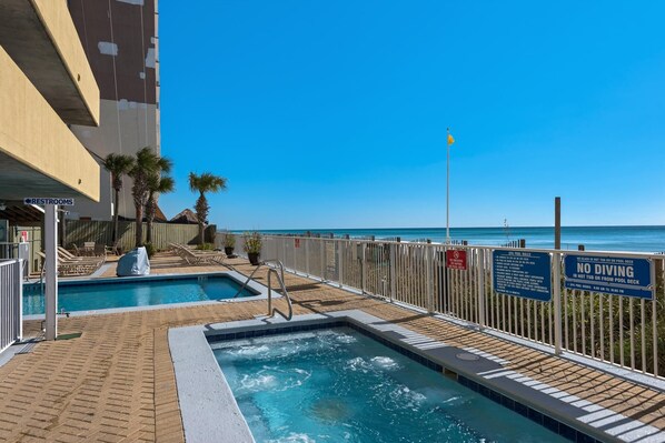 Relax by the ocean with a choice of two pools, including one with a hot tub, and enjoy comfortable lounge seating.