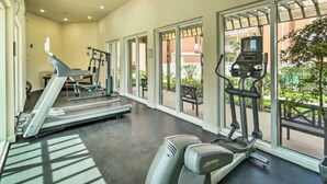 A gym with treadmills, elliptical machines, and a stationary bike. - Coral Cave Luxury Condo! Enjoy the beach, pools, BBQs, and bay views.  (South Padre Island)