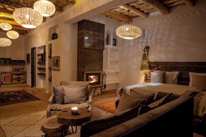 Deluxe Suite with Terrace | Living area | 52-inch Smart TV with satellite channels, fireplace