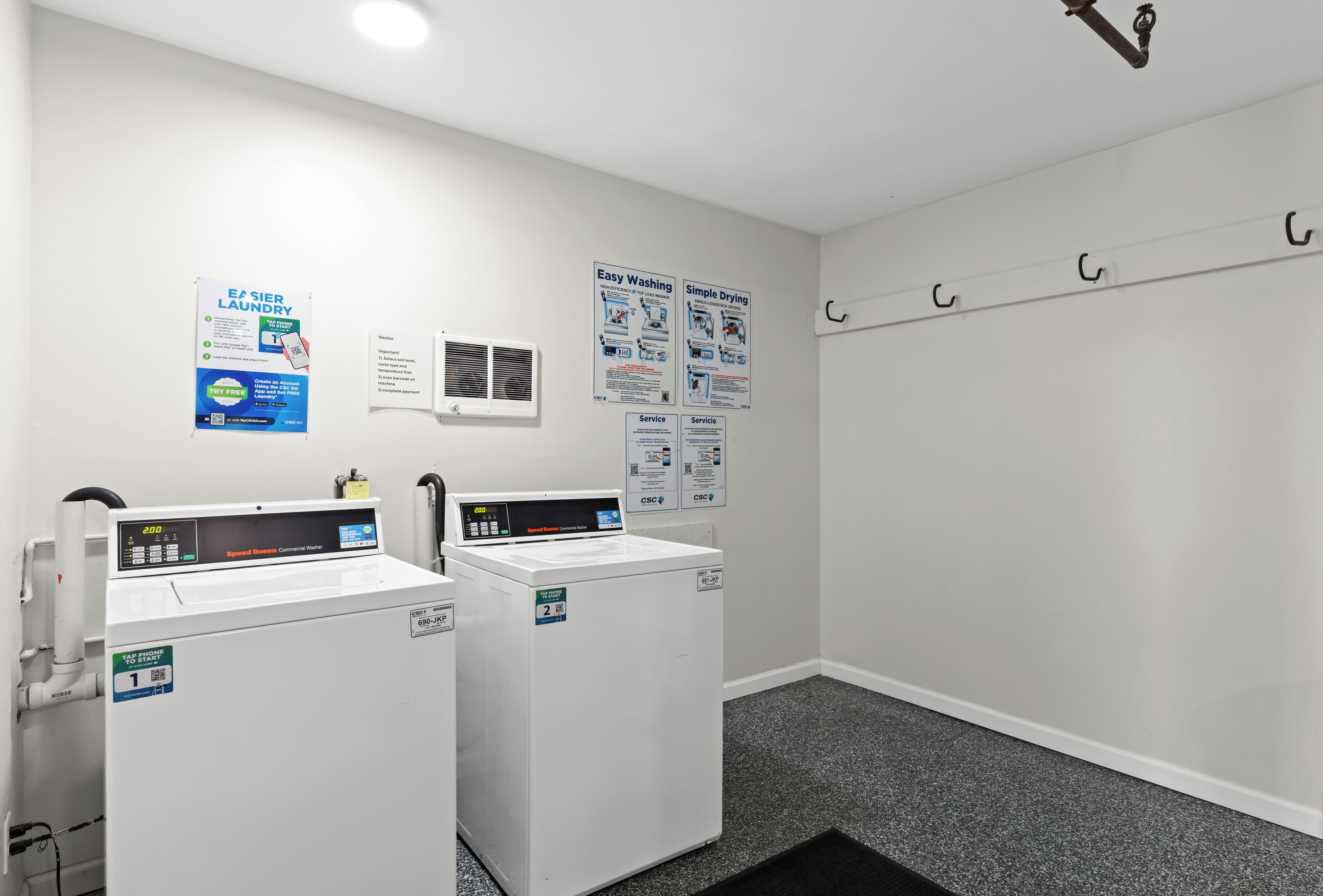Clean and accessible laundry facilities—machines accept both quarters and PayRange app payments.