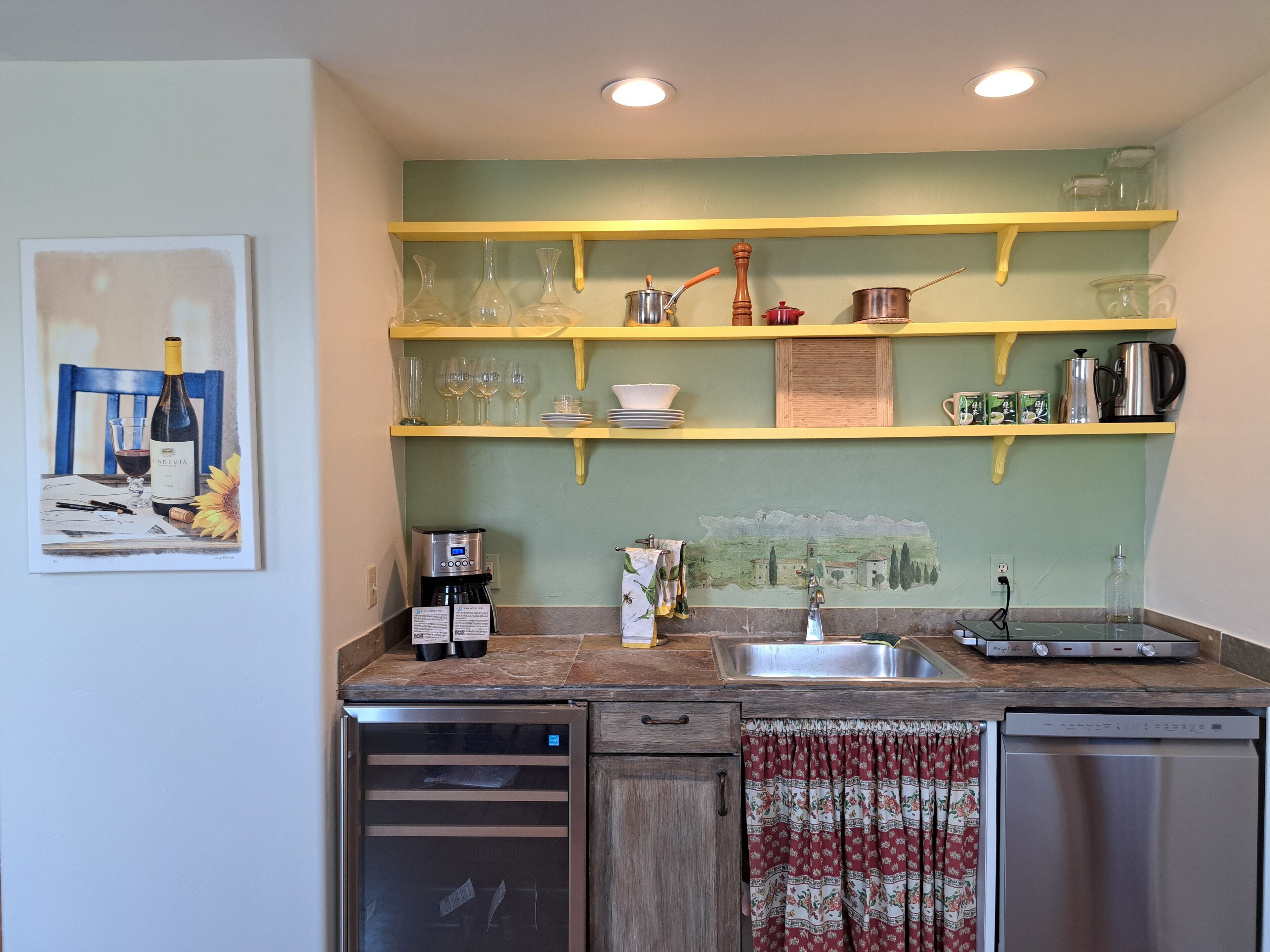 Fridge, stovetop, dishwasher, coffee/tea maker