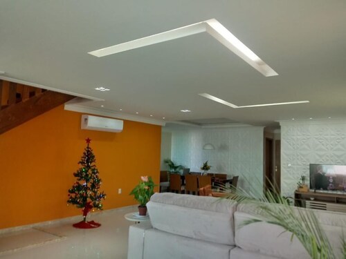 Spacious 4-bedroom, 5-bathroom condominium in gated community close to beach.