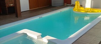 Spacious 4-bedroom, 5-bathroom condominium in gated community close to beach.