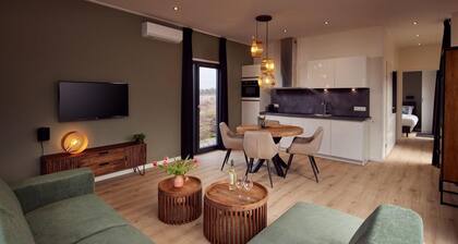 The Amalia is a four-person holiday home and has an attractive homely living room with an open kitchen, two bedrooms and a spacious outdoor area.