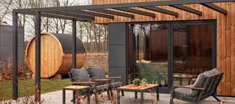 The Amalia 4 Deluxe is a luxurious holiday home with a private sauna, a spacious living room, open kitchen, two bedrooms and a large patio.