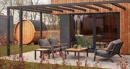 The Amalia 4 Deluxe is a luxurious holiday home with a private sauna, a spacious living room, open kitchen, two bedrooms and a large patio.