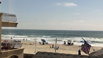 On the beach, sun-loungers