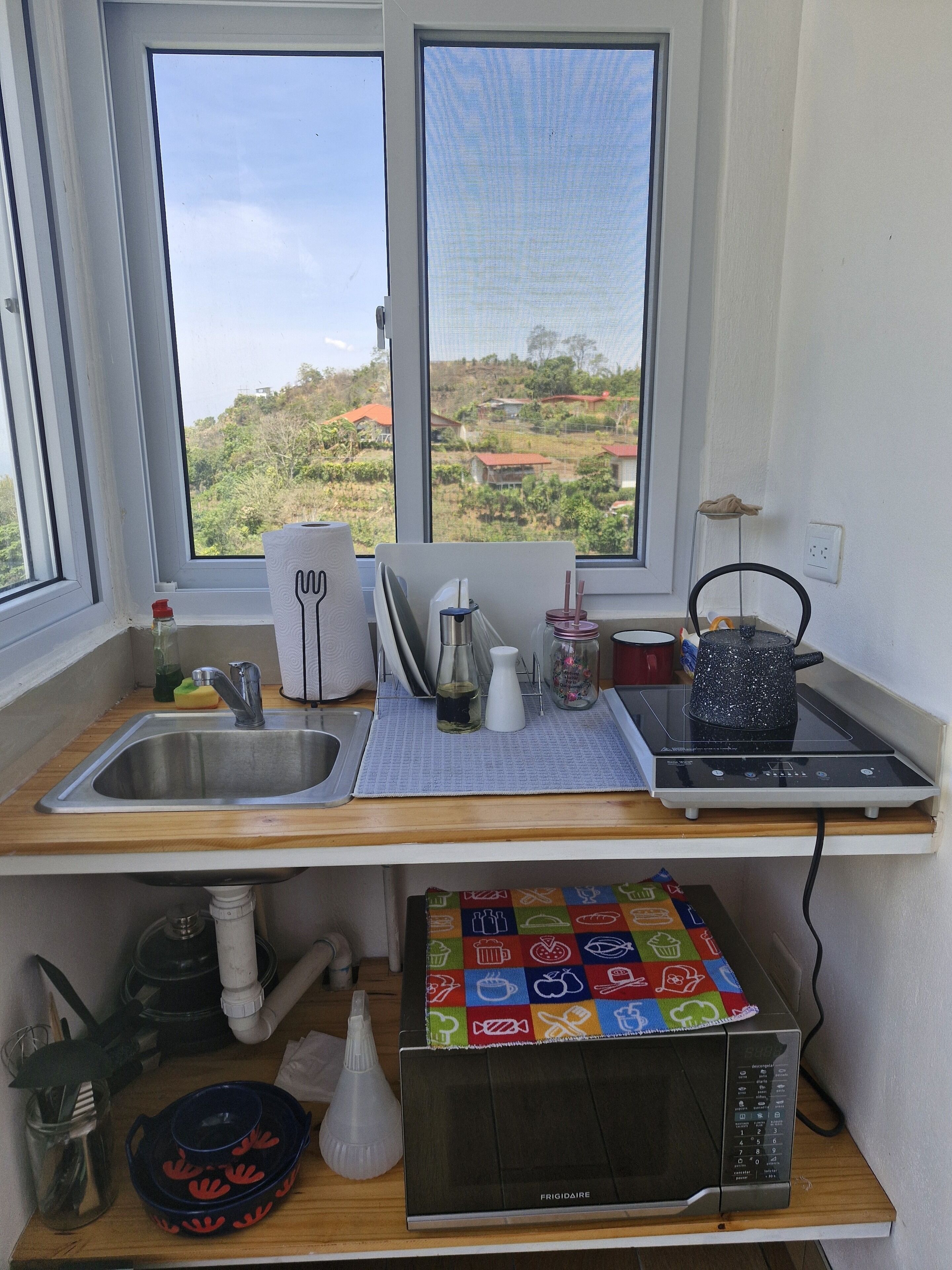 Fridge, microwave, stovetop, coffee/tea maker