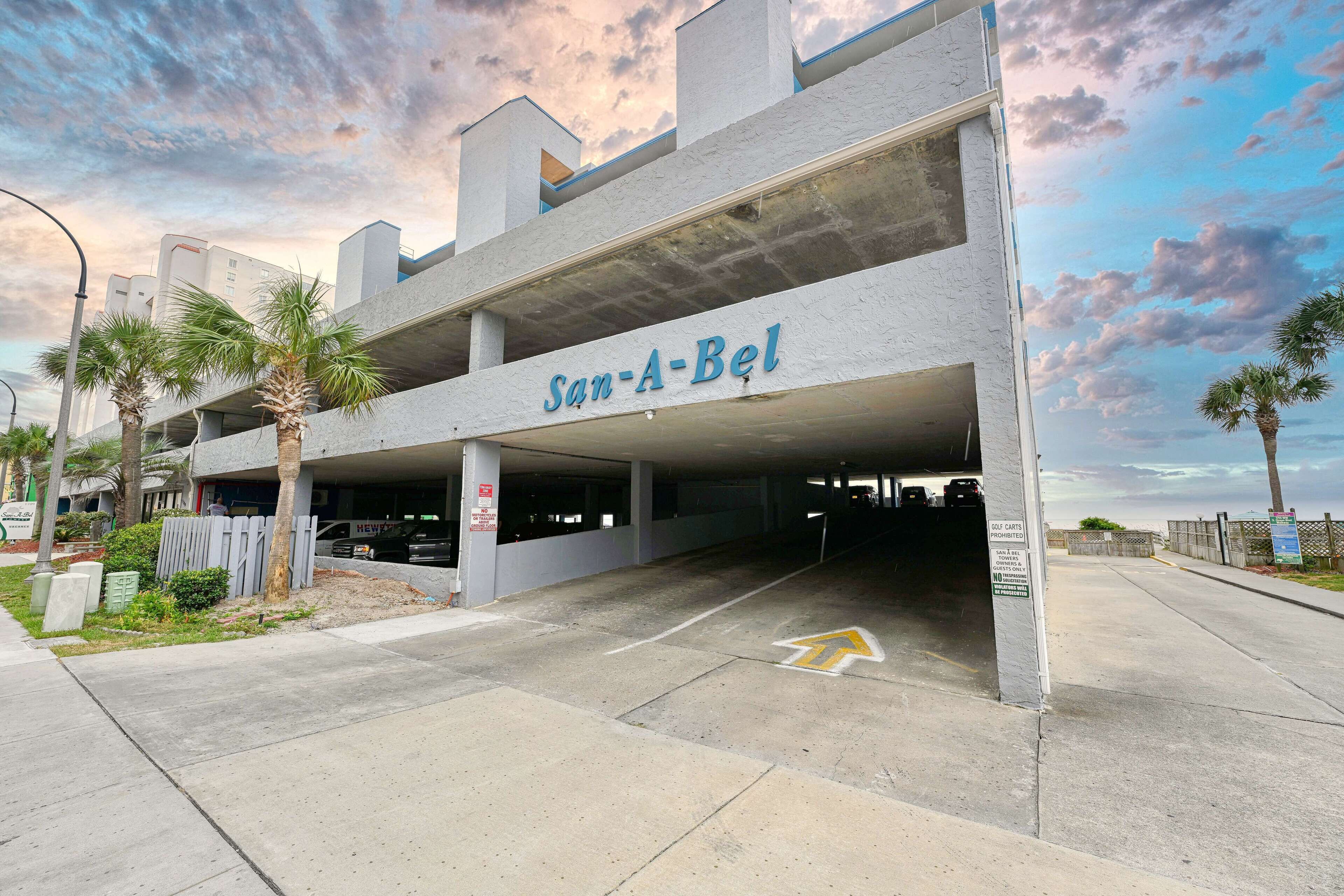 A multi-level parking garage with the sign 'San-A-Bel'.