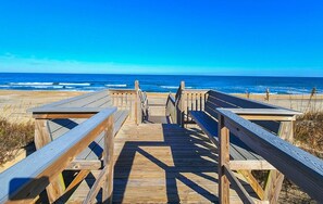 A wooden boardwalk leading to a beach with a clear blue sky. - Precious Rapture - Dog friendly, 200 yards to beach, 5 bed, 3.1 bath (Southern Shores)