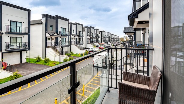 A modern residential building with a balcony, a covered walkway, and a view of the street. - Modern Elizabeth Apartment ~ 1 Mi to Train Station (Elizabeth)
