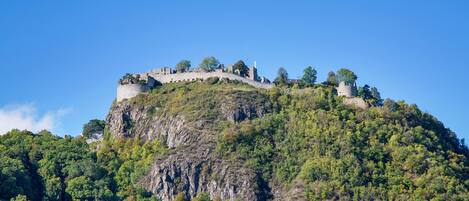 A castle on a hill with a clear sky.