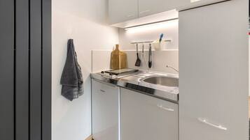 Fridge, microwave, stovetop, coffee/tea maker