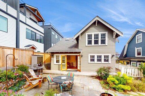 Century-old, dog-friendly home with hot tub, gorgeous patio & prime location