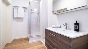 City Condo | Bathroom | Shower, hair dryer, towels, soap
