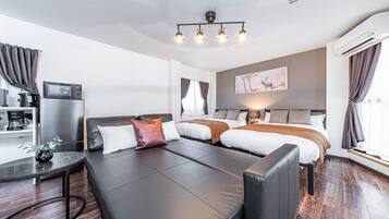 M's Tamatsukuri 3F | Living area | 50-inch flat-screen TV with cable channels