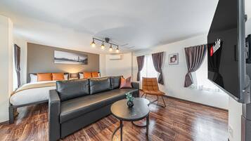 M's Tamatsukuri 4F | Living area | 50-inch flat-screen TV with cable channels