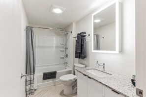 Shower, hair dryer, towels