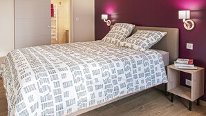 A bedroom with a bed, nightstands, a wardrobe, and a door leading to a bathroom. - Charming Winemaker's House in Castle Heartland, Terrace and Modern Comfort (Sambin)