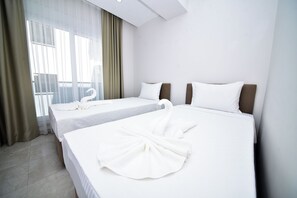 Premium bedding, blackout drapes, soundproofing, iron/ironing board