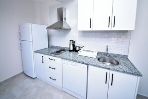 Basic Apartment | Private kitchen | Fridge, stovetop, dishwasher, highchair