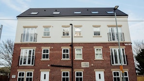 A two-story brick building with a sign reading "SHIELD HOUSE". - Peak District One King Bedroom Haven by Belvilla (Sheffield)